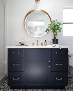How to Prepare Your Bathroom for Overnight Guests - Photo 4 of 8 - Two candles and a small plant make a lovely vignette; Source: Pencil and Paper Co. 