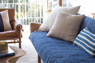 Essential Quilts: Behind the Design + Styling Tips - Photo 5 of 8 - Stylist Emily Henderson shows how to style an Essential Quilt on a couch; Source: Jess Isaac/Styled by Emily Henderson