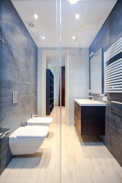 The house is spacious and the interior was designed in a manner, which kept this aspect highlighted: the entrance corridor leads to the large open area, uniting the kitchen, the living room and the dining room; The guest room wall, concealing the wardrobe, has two large incisions, making the wardrobe still part of the bedroom. Compelling design choice was also made for the master bedroom, where two sinks are not shying away from eye, but are rather put on display, as integral element of the bedroom.
Photo 16 of InnerEdges modern home