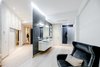 The house is spacious and the interior was designed in a manner, which kept this aspect highlighted: the entrance corridor leads to the large open area, uniting the kitchen, the living room and the dining room; The guest room wall, concealing the wardrobe, has two large incisions, making the wardrobe still part of the bedroom. Compelling design choice was also made for the master bedroom, where two sinks are not shying away from eye, but are rather put on display, as integral element of the bedroom.
Photo 9 of InnerEdges modern home