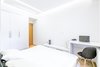 The low budget, family house project posed a challenge of conveniently arranging multiple rooms in small area. Pre-reconstruction edges of the walls were toned down, in order to conform to the new, minimalistic aesthetics and letting two colors prevail in the interior was also the part of the concept.
The white walls and the large mirrors make the space appear sizable. The wooden components of the interior bring a unifying ambience into play. The technical lighting illuminates the rooms without distracting the eye.
Photo 4 of PureLight modern home