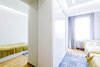 The low budget, family house project posed a challenge of conveniently arranging multiple rooms in small area. Pre-reconstruction edges of the walls were toned down, in order to conform to the new, minimalistic aesthetics and letting two colors prevail in the interior was also the part of the concept.
The white walls and the large mirrors make the space appear sizable. The wooden components of the interior bring a unifying ambience into play. The technical lighting illuminates the rooms without distracting the eye.
Photo of PureLight modern home