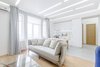 The low budget, family house project posed a challenge of conveniently arranging multiple rooms in small area. Pre-reconstruction edges of the walls were toned down, in order to conform to the new, minimalistic aesthetics and letting two colors prevail in the interior was also the part of the concept.
The white walls and the large mirrors make the space appear sizable. The wooden components of the interior bring a unifying ambience into play. The technical lighting illuminates the rooms without distracting the eye.
Photo 5 of PureLight modern home
