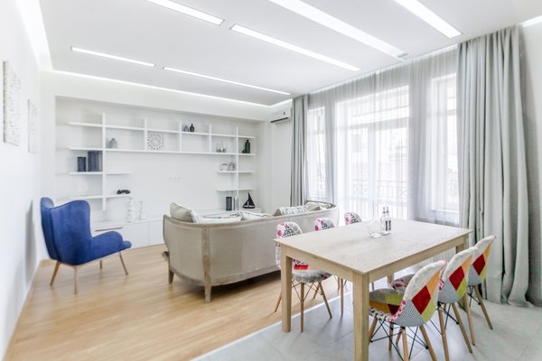 The low budget, family house project posed a challenge of conveniently arranging multiple rooms in small area. Pre-reconstruction edges of the walls were toned down, in order to conform to the new, minimalistic aesthetics and letting two colors prevail in the interior was also the part of the concept.
The white walls and the large mirrors make the space appear sizable. The wooden components of the interior bring a unifying ambience into play. The technical lighting illuminates the rooms without distracting the eye.
Photo 6 of PureLight modern home