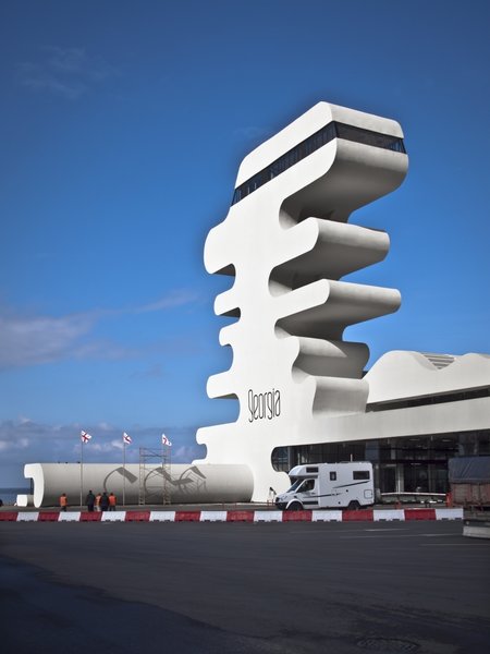 Sarpi border checkpoint is an architectural equivalent of a first impression. As a testament to this building being the entering point to Georgia, shape of the watchtower is inspired by the georgian lettering.
The customs hall for leaving Georgia is located closer to the seaside, than the one for entering the country and The duty free shop resides alongside to it.
The interior design is minimalistic in terms of both, forms and colors, amplifying the focus on functionality.
Architect's note: 'This project came with tight deadline and required meticulously thought-out planning of construction process, as it had to be put to use before the final completion of the building. Implementing interior design was particularly fulfilling experience for me.
My involvement in Sarpi border checkpoint and Mestia Airport projects served as a stepping stone for me, in terms of working independently as an architect and being more audacious in executing my personal architectural concepts that seemed way more challenging before.'
Photo 14 of Sarpi Border Checkpoint modern home