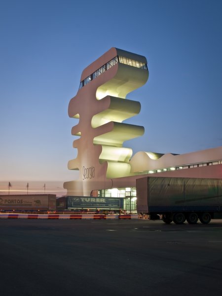 Sarpi border checkpoint is an architectural equivalent of a first impression. As a testament to this building being the entering point to Georgia, shape of the watchtower is inspired by the georgian lettering.
The customs hall for leaving Georgia is located closer to the seaside, than the one for entering the country and The duty free shop resides alongside to it.
The interior design is minimalistic in terms of both, forms and colors, amplifying the focus on functionality.
Architect's note: 'This project came with tight deadline and required meticulously thought-out planning of construction process, as it had to be put to use before the final completion of the building. Implementing interior design was particularly fulfilling experience for me.
My involvement in Sarpi border checkpoint and Mestia Airport projects served as a stepping stone for me, in terms of working independently as an architect and being more audacious in executing my personal architectural concepts that seemed way more challenging before.'
Photo 2 of Sarpi Border Checkpoint modern home