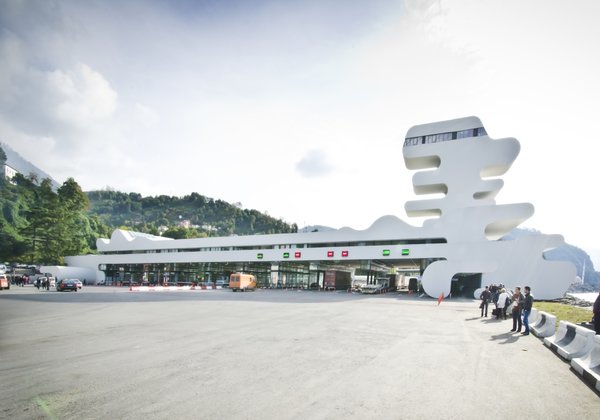 Sarpi border checkpoint is an architectural equivalent of a first impression. As a testament to this building being the entering point to Georgia, shape of the watchtower is inspired by the georgian lettering.
The customs hall for leaving Georgia is located closer to the seaside, than the one for entering the country and The duty free shop resides alongside to it.
The interior design is minimalistic in terms of both, forms and colors, amplifying the focus on functionality.
Architect's note: 'This project came with tight deadline and required meticulously thought-out planning of construction process, as it had to be put to use before the final completion of the building. Implementing interior design was particularly fulfilling experience for me.
My involvement in Sarpi border checkpoint and Mestia Airport projects served as a stepping stone for me, in terms of working independently as an architect and being more audacious in executing my personal architectural concepts that seemed way more challenging before.'
Photo 13 of Sarpi Border Checkpoint modern home