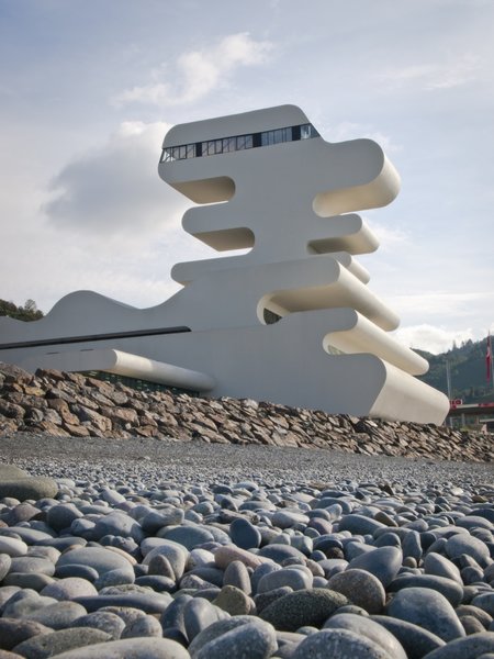 Sarpi border checkpoint is an architectural equivalent of a first impression. As a testament to this building being the entering point to Georgia, shape of the watchtower is inspired by the georgian lettering.
The customs hall for leaving Georgia is located closer to the seaside, than the one for entering the country and The duty free shop resides alongside to it.
The interior design is minimalistic in terms of both, forms and colors, amplifying the focus on functionality.
Architect's note: 'This project came with tight deadline and required meticulously thought-out planning of construction process, as it had to be put to use before the final completion of the building. Implementing interior design was particularly fulfilling experience for me.
My involvement in Sarpi border checkpoint and Mestia Airport projects served as a stepping stone for me, in terms of working independently as an architect and being more audacious in executing my personal architectural concepts that seemed way more challenging before.'
Photo 5 of Sarpi Border Checkpoint modern home