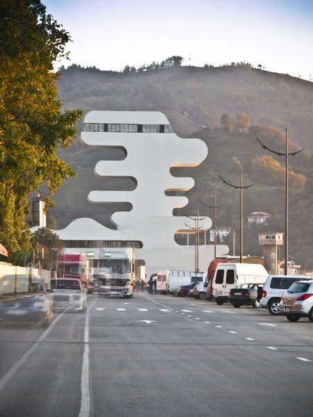Sarpi border checkpoint is an architectural equivalent of a first impression. As a testament to this building being the entering point to Georgia, shape of the watchtower is inspired by the georgian lettering.
The customs hall for leaving Georgia is located closer to the seaside, than the one for entering the country and The duty free shop resides alongside to it.
The interior design is minimalistic in terms of both, forms and colors, amplifying the focus on functionality.
Architect's note: 'This project came with tight deadline and required meticulously thought-out planning of construction process, as it had to be put to use before the final completion of the building. Implementing interior design was particularly fulfilling experience for me.
My involvement in Sarpi border checkpoint and Mestia Airport projects served as a stepping stone for me, in terms of working independently as an architect and being more audacious in executing my personal architectural concepts that seemed way more challenging before.'
Photo 16 of Sarpi Border Checkpoint modern home