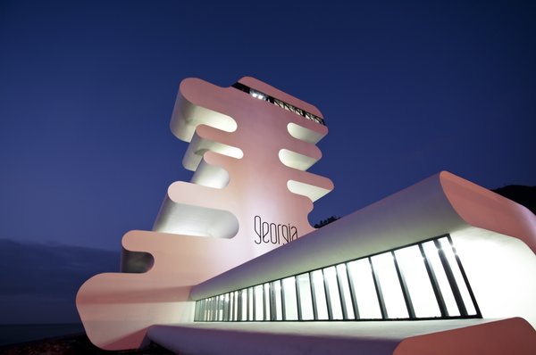 Sarpi border checkpoint is an architectural equivalent of a first impression. As a testament to this building being the entering point to Georgia, shape of the watchtower is inspired by the georgian lettering.
The customs hall for leaving Georgia is located closer to the seaside, than the one for entering the country and The duty free shop resides alongside to it.
The interior design is minimalistic in terms of both, forms and colors, amplifying the focus on functionality.
Architect's note: 'This project came with tight deadline and required meticulously thought-out planning of construction process, as it had to be put to use before the final completion of the building. Implementing interior design was particularly fulfilling experience for me.
My involvement in Sarpi border checkpoint and Mestia Airport projects served as a stepping stone for me, in terms of working independently as an architect and being more audacious in executing my personal architectural concepts that seemed way more challenging before.'
Photo 7 of Sarpi Border Checkpoint modern home