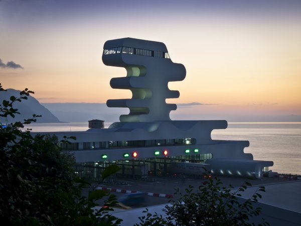 Sarpi border checkpoint is an architectural equivalent of a first impression. As a testament to this building being the entering point to Georgia, shape of the watchtower is inspired by the georgian lettering.
The customs hall for leaving Georgia is located closer to the seaside, than the one for entering the country and The duty free shop resides alongside to it.
The interior design is minimalistic in terms of both, forms and colors, amplifying the focus on functionality.
Architect's note: 'This project came with tight deadline and required meticulously thought-out planning of construction process, as it had to be put to use before the final completion of the building. Implementing interior design was particularly fulfilling experience for me.
My involvement in Sarpi border checkpoint and Mestia Airport projects served as a stepping stone for me, in terms of working independently as an architect and being more audacious in executing my personal architectural concepts that seemed way more challenging before.'
Photo 6 of Sarpi Border Checkpoint modern home