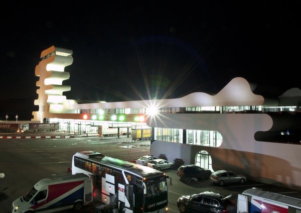 Sarpi border checkpoint is an architectural equivalent of a first impression. As a testament to this building being the entering point to Georgia, shape of the watchtower is inspired by the georgian lettering.
The customs hall for leaving Georgia is located closer to the seaside, than the one for entering the country and The duty free shop resides alongside to it.
The interior design is minimalistic in terms of both, forms and colors, amplifying the focus on functionality.
Architect's note: 'This project came with tight deadline and required meticulously thought-out planning of construction process, as it had to be put to use before the final completion of the building. Implementing interior design was particularly fulfilling experience for me.
My involvement in Sarpi border checkpoint and Mestia Airport projects served as a stepping stone for me, in terms of working independently as an architect and being more audacious in executing my personal architectural concepts that seemed way more challenging before.'
Photo 8 of Sarpi Border Checkpoint modern home