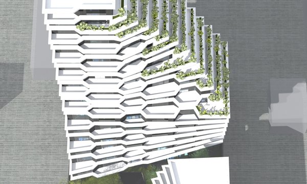 Sense of smooth gradation and movement comes from both, the spatial positioning of the buildings and the design of each. For them to be perceived as a consolidated structure, the taller building cedes the foreground to the five storied hotel/office building, with oblique road beside it that leads to the underground garage. \
As the apartment building gains height, it twists at different angles in the same direction. This arrangement required individual designing of every apartment and ones, that face the sea, have terraces.
Photo 9 of Hive modern home