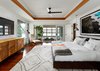 Modern home with Hardscapes, Back Yard, Large Patio, Porch, Deck, Landscape Lighting, Ceiling Lighting, Recessed Lighting, Sectional, Coffee Tables, Metal Fence, Ottomans, Table, Accent Lighting, Stools, Wood Patio, Porch, Deck, Decking Patio, Porch, Deck, Dresser, Undermount Sink, Two Piece Toilet, Chair, and Gas Burning Fireplace. The Master bedroom featuring a burl wood cabinet by Romweber, custom platform bed, early Milo Baughman chair and ottoman by James Co., opening to the screened porch featuring Restoration Hardware's Costa Luxe double lounger. Over the bed is an original print of David Drebin's Looking Down flanked by a pair of vintage Jo Hammerborg pendant lights. The rug is Moroccan from Black Sheep Unique in Austin, TX. Photo 16 of Lake Austin Remodel