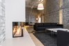 Modern home with Office. DYIers Insider Tip:
For all you DYIers out there wondering how Chong and his team got that seductive white-washed brick finish. The bricks were painted, then sandblasted, and finally hit with a clear-coat finish to give the walls a look that is a little bit vintage, a little bit modern and all hygge. Photo 4 of Mithun Agency
