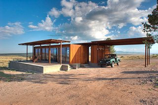 This Texas modular, dubbed the Marfa Weehouse, provides sweeping views from its sheltered deck. Conceptualized as the first in a three dwelling compounds, this home shelters a bedroom, bathroom, and a utility shed. Although only 400 square feet, the expansive steel pergola doubles the visual volume of this wee home.