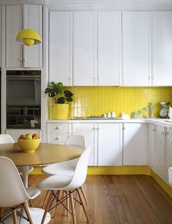 How the Colors in Your Kitchen Affect Your Appetite - Photo 6 of 11 - This sunny yellow kitchen successfully mixes vintage charm with mid-century furniture.