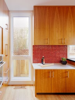 How the Colors in Your Kitchen Affect Your Appetite - Photo 7 of 11 - In this California home, a red mosaic tiled backsplash balances the lower white marble counter.