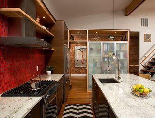How the Colors in Your Kitchen Affect Your Appetite - Photo 8 of 11 - This Washington DC row house conversion maintains an industrial feel courtesy of brick walls, dark woods, and a fiery red backsplash wall.