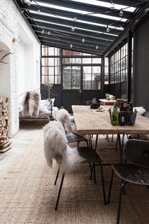 10 Ways to Use Rugs in Your Outdoor Space This Spring - Photo 5 of 10 - Though this sunroom is technically enclosed, it serves as year-round gathering area that acts as an outdoor space—even during the cold German winters. 