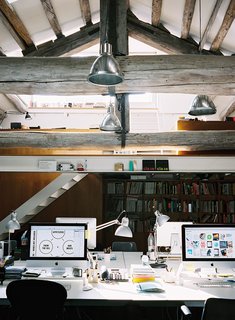 10 Ways to Create a Modern Workspace in Your Attic - Photo 1 of 10 - This multi-level attic is home to a creative firm that use the lower space for its production studio and the upper space for meetings or traditional work. 