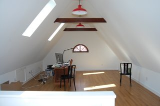 10 Ways to Create a Modern Workspace in Your Attic - Photo 10 of 10 - The skylights that descend into the wall plane bring in natural light and provide views of the historic neighborhood. 