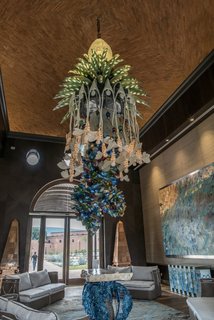 Patrón Designed a Spanish Colonial Guest House with Modern Flair - Photo 9 of 14 - The reclaimed wood ceiling has agave bees carved into in order to represent their importance in the local production process for Tequila. 