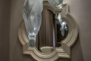 Patrón Designed a Spanish Colonial Guest House with Modern Flair - Photo 12 of 14 - Contemporary glass fixtures with fluid, natural shapes harmoniously blend with the more traditional elements found in throughout the house. 