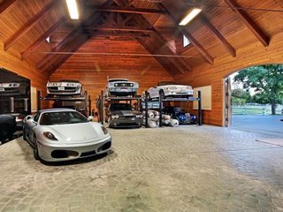 10 Prefab Garage Solutions For Auto Enthusiasts - Photo 1 of 10 - How about a customized barn to house that prized classic car collection? Barn Pros can set you up with a wide variety of barn building packages including everything from blueprints (you could pay up to $30,000 for those alone) to lumber and hardware—the only materials not included are nails, concrete, and the final layer of roofing.