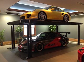 10 Prefab Garage Solutions For Auto Enthusiasts - Photo 7 of 10 - Add an extra Porsche with a custom residential car lift by American Custom Lifts, designers of the first and only American-made, single-post car lift for storing two vehicles in the parking space of one. 