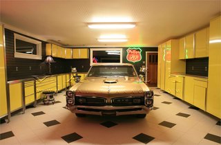 10 Prefab Garage Solutions For Auto Enthusiasts - Photo 8 of 10 - From beautiful carriage doors to stainless steel cabinets and antique memorabilia neon signs, Portland-based company Vault designs gorgeous spaces.