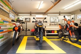 10 Prefab Garage Solutions For Auto Enthusiasts - Photo 6 of 10 - Add a dash of flair and color with rubber floor coating. Some of the advantages include a low cost and resistance, to mechanical and chemical damage. Rubber floors are also non-slip, resistant to extreme temperatures, and are easily repaired.