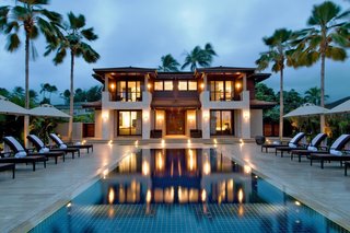 10 Dream Modern Home Rentals In Hawaii - Photo 1 of 10 - The 7 bedroom, 7.5 bath Royal Beach Estate is one of the newest, most striking and contemporary executive beachfront estates on world-renowned Kailua beach. Constructed in 2008, the estate features two homes (main house and guest house) separated by a resort-style pool with elegant umbrellas and lounge furnishings. Rental will set you back $8,665 per night for up to a maximum of 18 guests! 