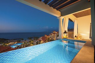14 Really Romantic Island Resort Retreats - Photo 1 of 15 - Defying every convention of traditional design, the new Sandals LaSource Grenada takes innovation beyond the realm of imagination. Pools in the sky and living rooms in swimming pools. Private plunge pools, cascading waterfalls and meandering river pools. Here, in the heart of Grenada's exclusive Pink Gin Beach, on an exotic island paradise where the intoxicating scents of spice and tropical blooms make a heady elixir for romance. 