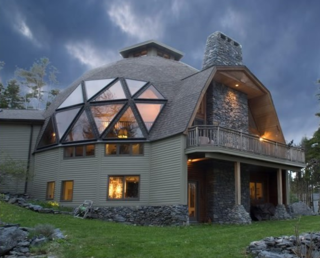 Natural Spaces offers this small, comfortable dome giving you full-size features in a tiny home. The main floor has 400 square feet, allowing for a living room with standard furniture, a kitchen with full-size appliances, a dining room that allows you to have dinner for eight, and a bathroom that accommodates two people at the same time—along with a stacked, full-size washer and dryer. 