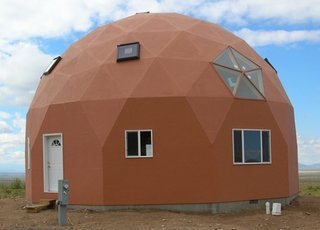 The standard EconoOdome may be fitted with arched trim boards above the windows and doors. This accent trim acts as a canal to control rain water flowing over the EconOdome surface. 