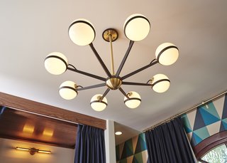 California Dreamers: Boys Bedroom By Sarah Barnard - Photo 2 of 3 - The vintage inspired brass and black chandelier makes the room glow with warm diffuse light.