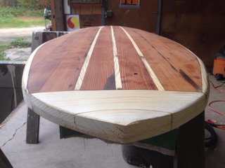 Crafting a Hollow Wood Surfboard from Old-Growth Redwood - Photo 16 of 26 - Before shaping the nose. The small hole in the deck allows for a screw-in plug later, necessary to vent air from the hollow core after each surf. Air trapped inside the board expands with heat, creating pressure.