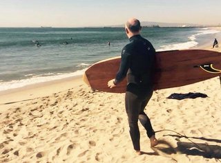 Crafting a Hollow Wood Surfboard from Old-Growth Redwood - Photo 24 of 26 - The surf was very small, perhaps the ideal conditions to take a test ride.
