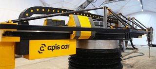 World's First 3D-Printed House Springs up in Russia in 24hrs - Photo 1 of 8 - The Apis Cor 3D printing "arm" is reminiscent of a tower crane and is small, easily transportable and does not require detailed preparation before construction can begin, utilizing a built-in automatic horizon alignment and stabilization system. The printing process is automated and almost eliminates human error.