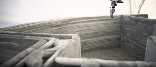 World's First 3D-Printed House Springs up in Russia in 24hrs - Photo 2 of 8 - The mineral plaster consists of white cement and ball-shaped marble and granite crumbs.