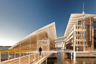 12 Renzo Piano Buildings We Love - Photo 4 of 12 - Designed to house the Astrup Fearnley Museum's permanent collection, this space also includes a separate space for its temporary exhibitions and an office building that has its own exhibition area for a private art collection. This strong, timber-clad shelter dwells under a single swooping glass roof in a newly landscaped public sculpture garden. 