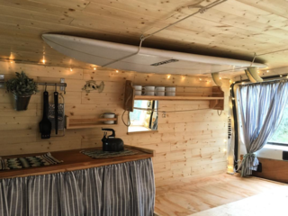 9 Adventure Seekers Who Celebrate Small Space Living Through the Van Life - Photo 5 of 10 - Hatti and Jake are on a roll in their minimalist wagon, in search of surf and soul along the European coast.