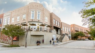 An Eco-Friendly Community Outside of Atlanta Celebrates Nature and Sustainability - Photo 3 of 10 - Housing includes loft-like apartments and townhouses in a range of traditional styles with double-hung, operable windows and brick facades.