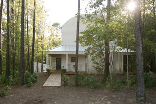 An Eco-Friendly Community Outside of Atlanta Celebrates Nature and Sustainability - Photo 5 of 10 - Farmhouse-style homes feature corrugated metal, standing-seam metal roofs, and wood siding.