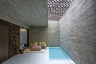 5 Striking Designs That Use Perforated Cement Breeze-Blocks in Interesting Ways - Photo 6 of 10 - The use of the two types of concrete continues throughout the project, both in the interior and exterior spaces. 