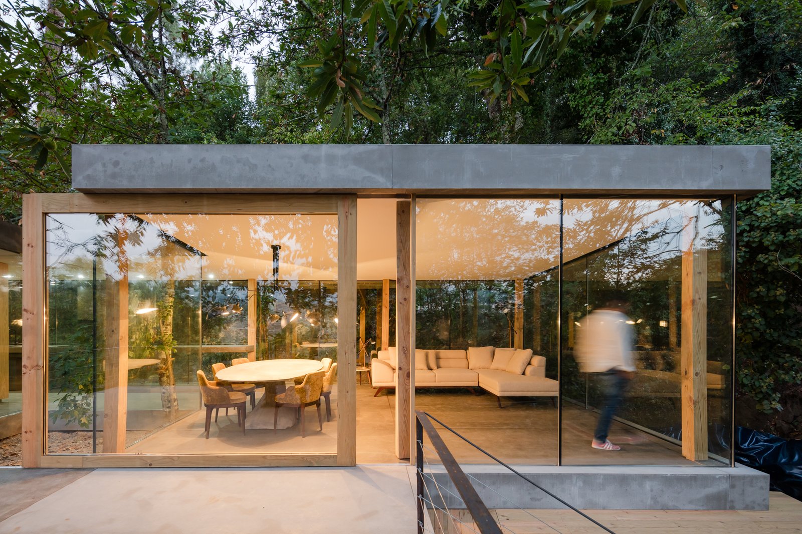 Some of the large planes of glass are sliding doors that open to the outside.