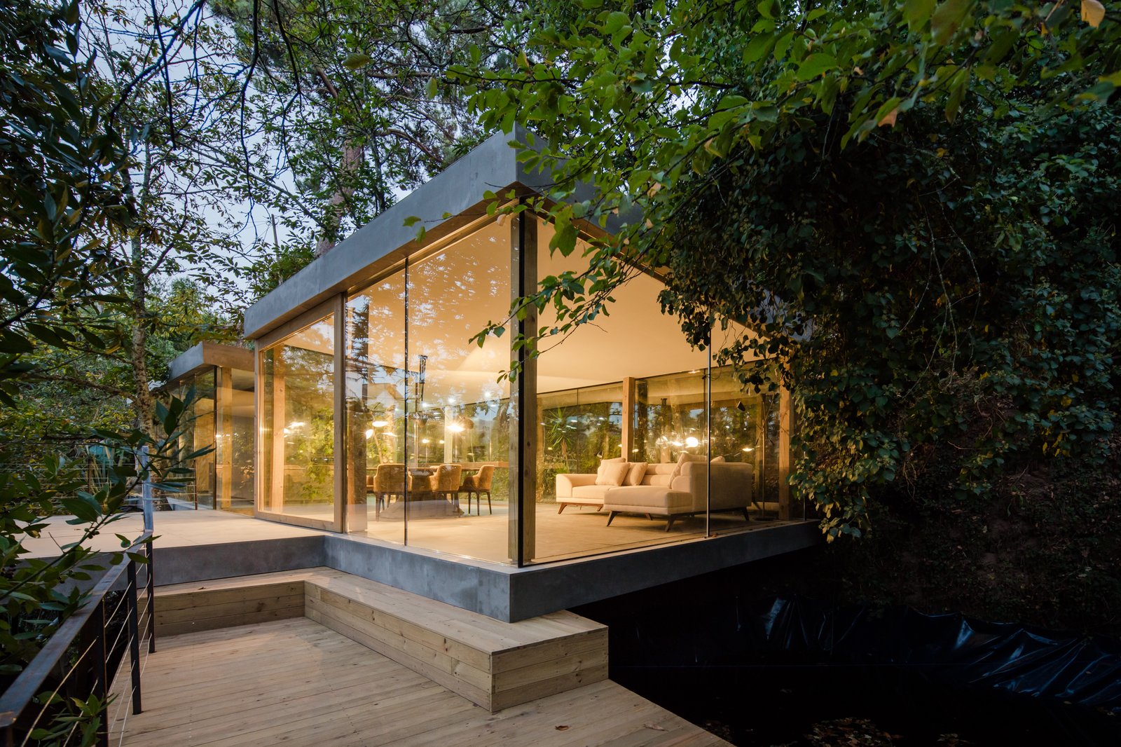 Concrete floors and roof contrast with large expanses of glazing.