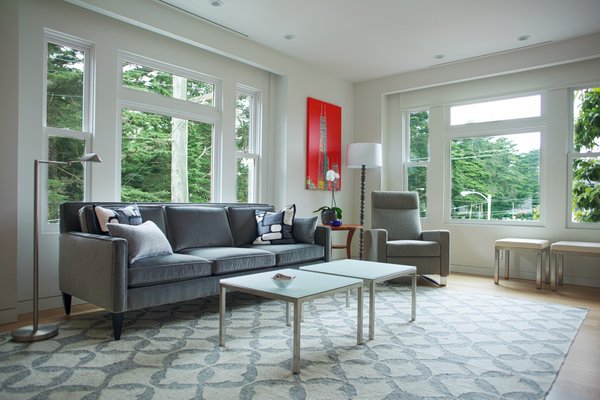 New double-paned windows and casements were manufactured to fit into the existing window design to match with the flat below. Solar shades are hidden above for privacy at night and light filtering during the day. Linear diffusers for the new HVAC system were installed above all of the windows in public parts of the home. Photo 4 of Golden Gate Park Residence modern home