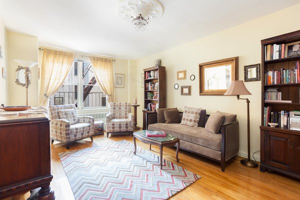 Modern home with living room, chair, sofa, coffee tables, end tables, ceiling lighting, and light hardwood floor. 9201 Shore Road, Bay Ridge - $199,000
Much desired 9201 Shore Road has just listed a wonderfully designed studio/1 bath with plenty of closets throughout and a dressing room alcove. This u-shaped studio is perfectly configured to maximize the space The smart layout of the unit provides you the with the option to have a full sized dining table right outside the galley kitchen, separate from the living space. Photo of Five Fabulous NYC Homes For Under $500K